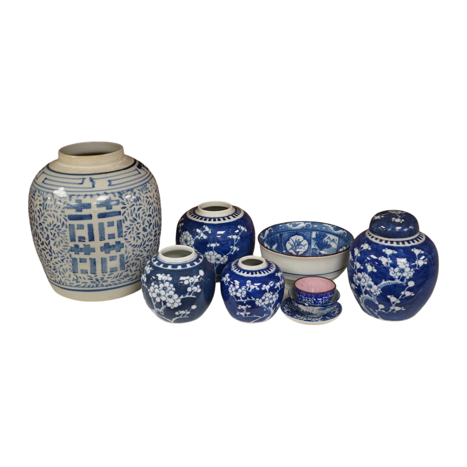 A group of Chinese blue and white porcelain, including a mid 19th century Canton enamel teabowl and a Japanese small dish, tallest 22cm. Condition - fair